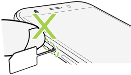 Illustration warning not to press the tray when inserting the eject tool.